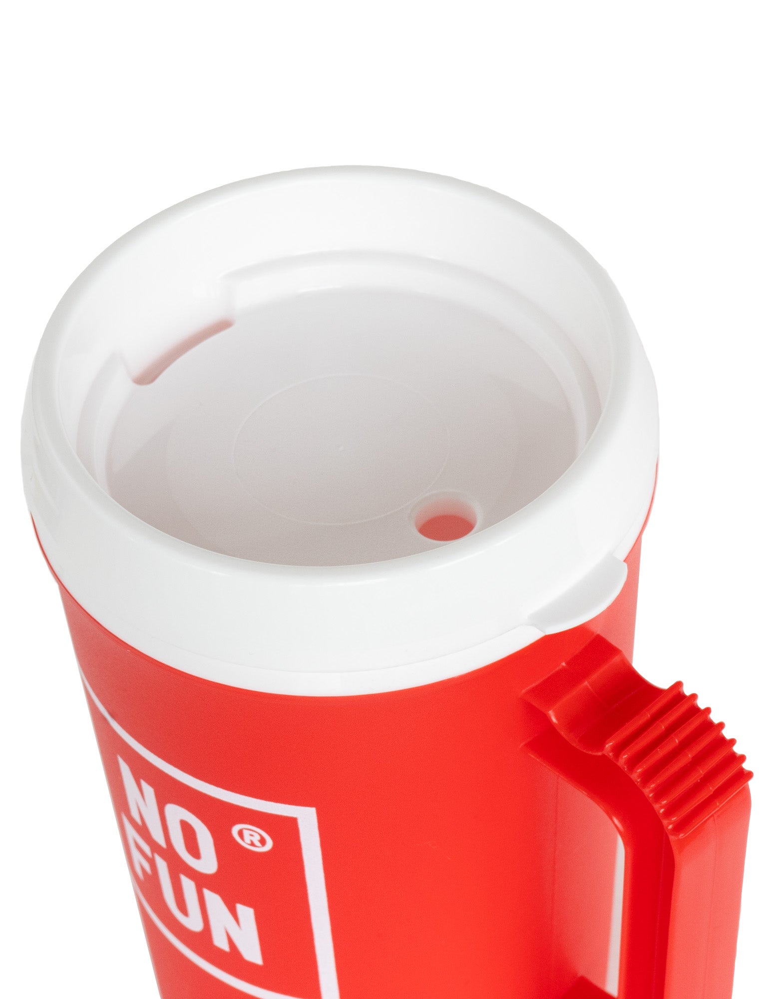 "Big Sipper" Mug by No Fun® in the colour red.  The image is a close up view of the lid which is white.  The lid features a hole for a straw, as well as a small opening for drinking.  The handle can be seen in the photo, as well as the square "No Fun®" logo that is printed in white.