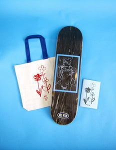 A product photo of all items within the Christian Stearry "Fresh Air" collaboration with "NO FUN®".  The collection includes a cream tote bag with blue handle and red flower image.  A skateboard deck with illustrated nude woman, and lastly a photo of the "Fresh Air" zine is included.