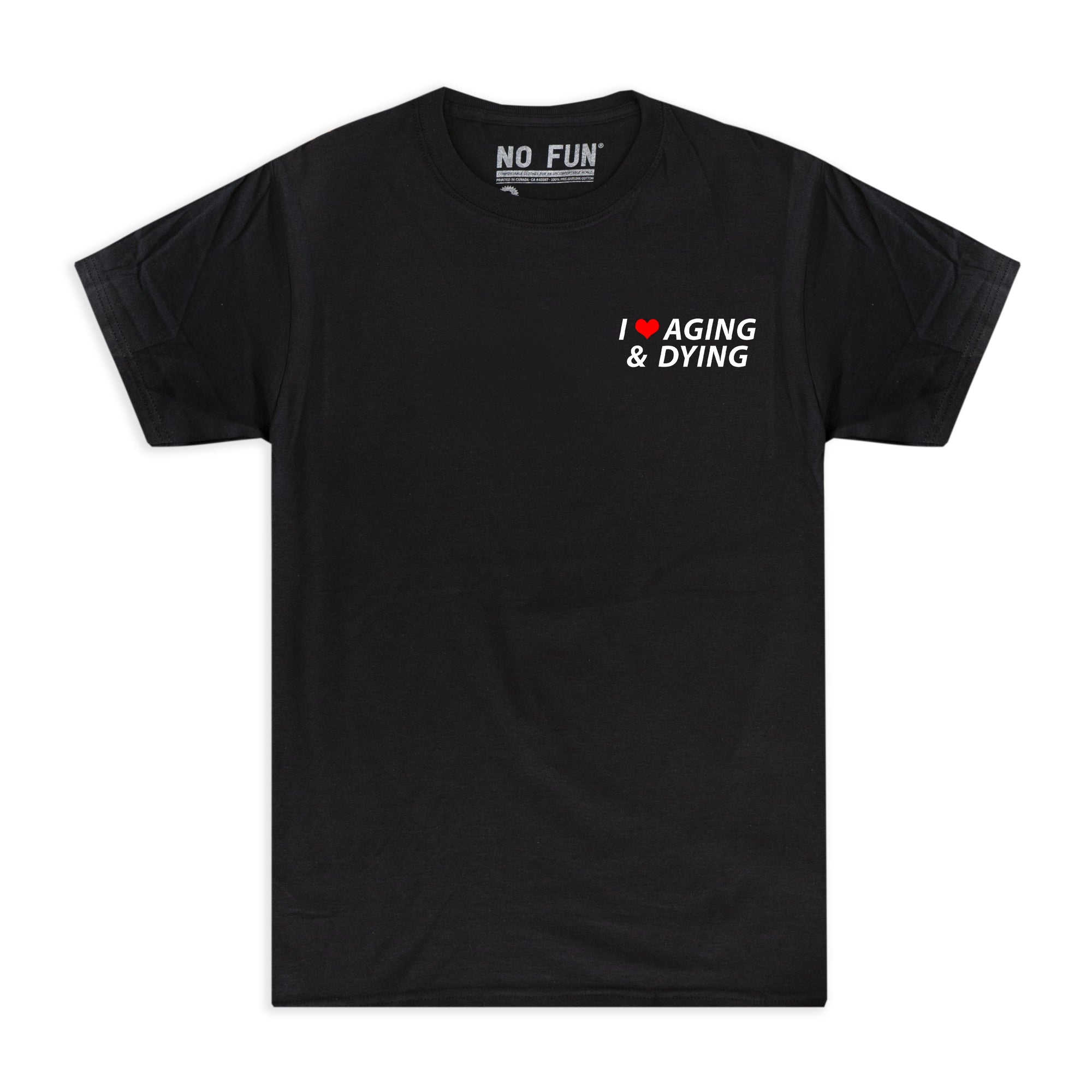 The original "Aging & Dying" T-shirt by No Fun®.  T-shirt is black, and is photographed against a white background.  The left chest print text reads "I ❤️ Aging & Dying" and is located on the front of the T-shirt.   The text is white, with a red heart.