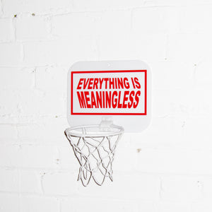 "Nihilist" Basketball game mounted onto a brick wall.