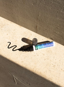 "Oil Slick™" Paint marker in black by No Fun®.