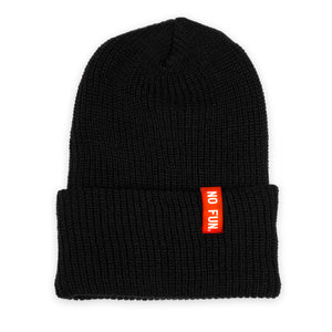 Photo of the "No Fun®" Ribbed beanie photographed against a white background.  Beanie is Black, and features a small, red, woven label that folds over the cuff.  The text on the red label says "No Fun®" in white.