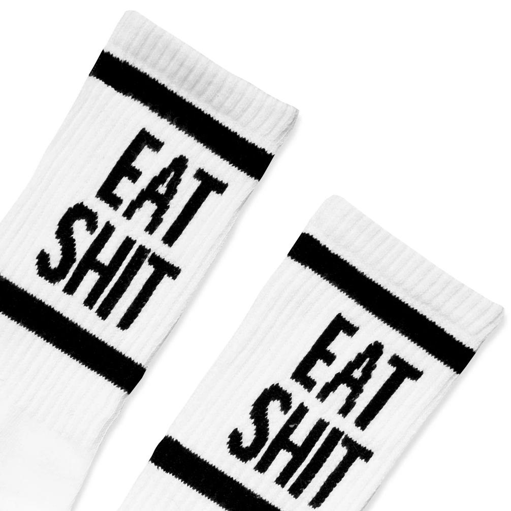 Detail of the "Eat Shit" text in black on the leg of the socks
