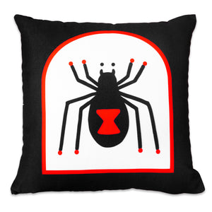 The "Devil & Black Widow" Pillow by No Fun®. Pillow is black, with a double sided design. One side has a red and white tombstone shape with a cartoon spider in the center. The Spider has a large, red, hourglass on its body.  