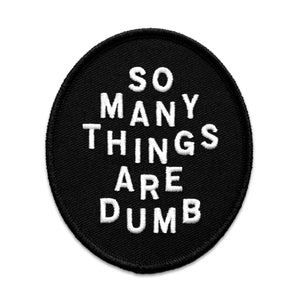 Original "So Many Things Are Dumb" patch from "NO FUN®". Patch measures 3" X 3.5" and features white embroidered text on a black oval patch, with black embroidered edge. The patch is photographed on a white background, and can be stitched, or ironed on.