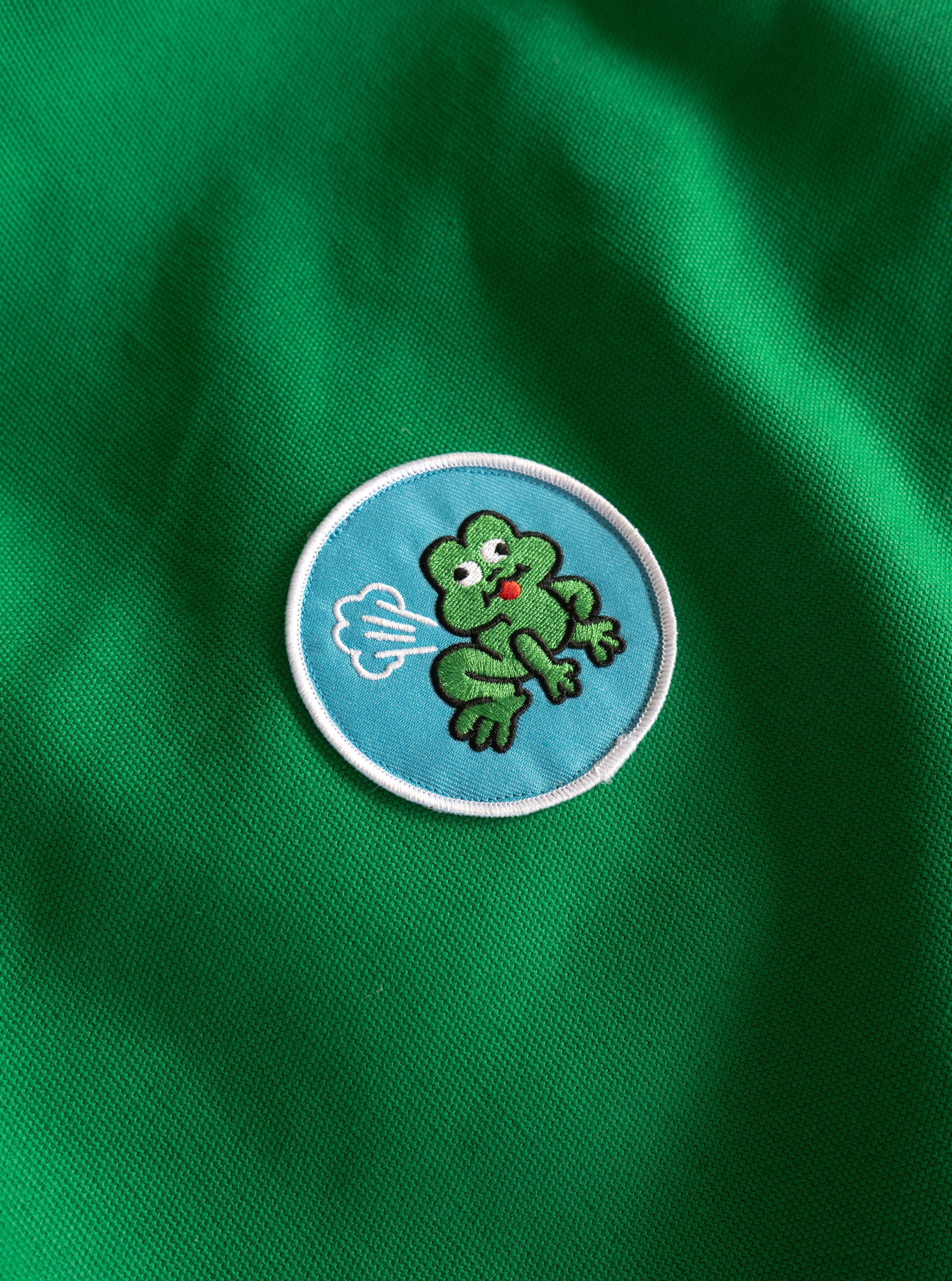 The "Farting Frog" patch on a piece of green canvas.