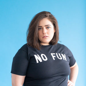"No Fun®" T-shirt being worn by a female model.  She is photographed in front of a blue background.
