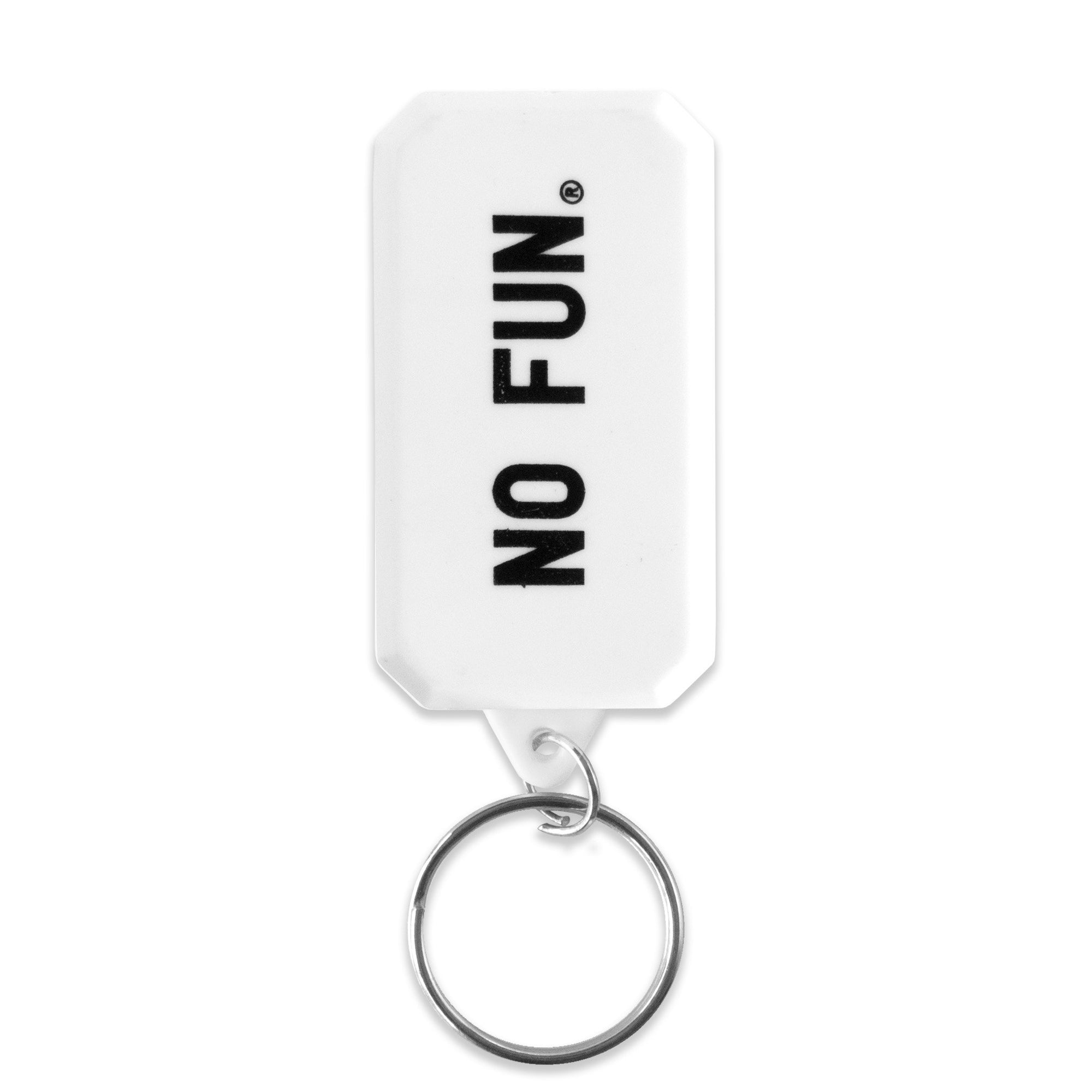 A photo of the backside of the compass keychain.  The "NO FUN®" logo is printed in black along the back.