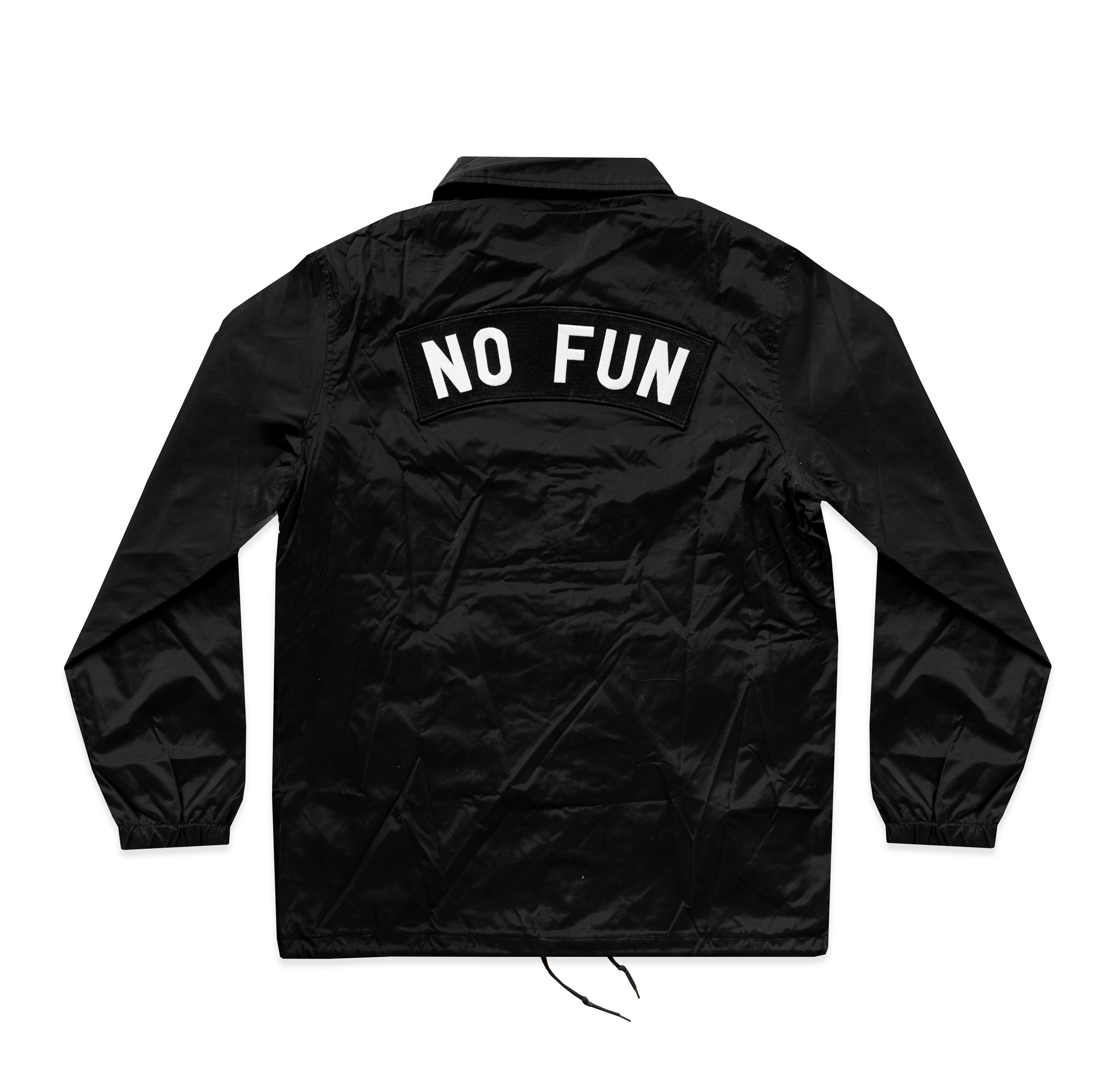 Photo of the backside of the "NO FUN®" X "Crawling Death" coaches jacket. The jacket is black and features an oversized "NO FUN®" rocker patch that sits above the shoulder blades. The jacket utilizes snap closures and drawstring cords at the bottom.