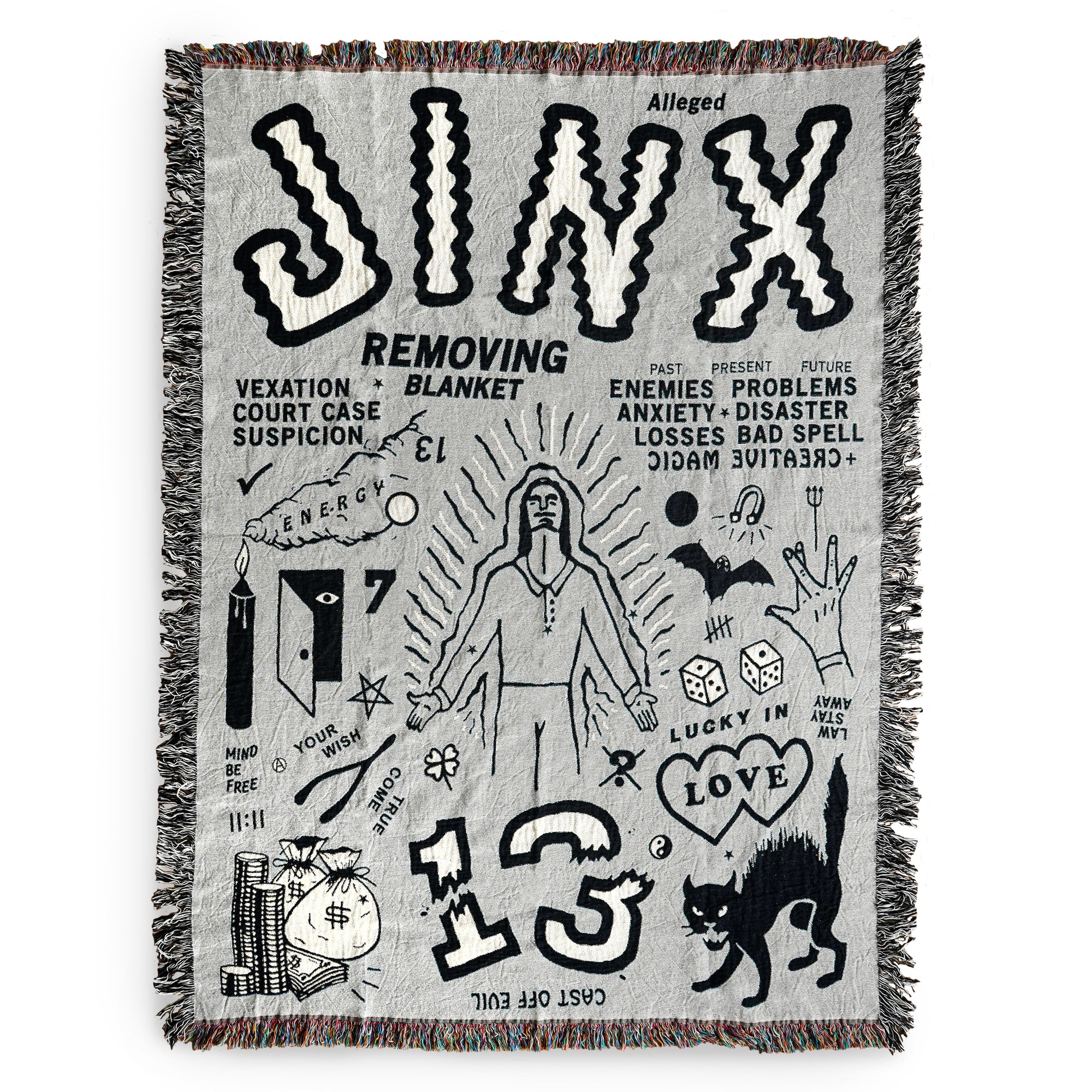 The "Alleged Jinx Removing" Woven Blanket.  The blanket is photographed against a white background.  The blanket features the word "Jinx" in large letters across the top.  The blanket also features many images including, but not limited to, a candle, a pile of money, a black cat, two hearts, crossed fingers, dice, wishbone, and a large "13".