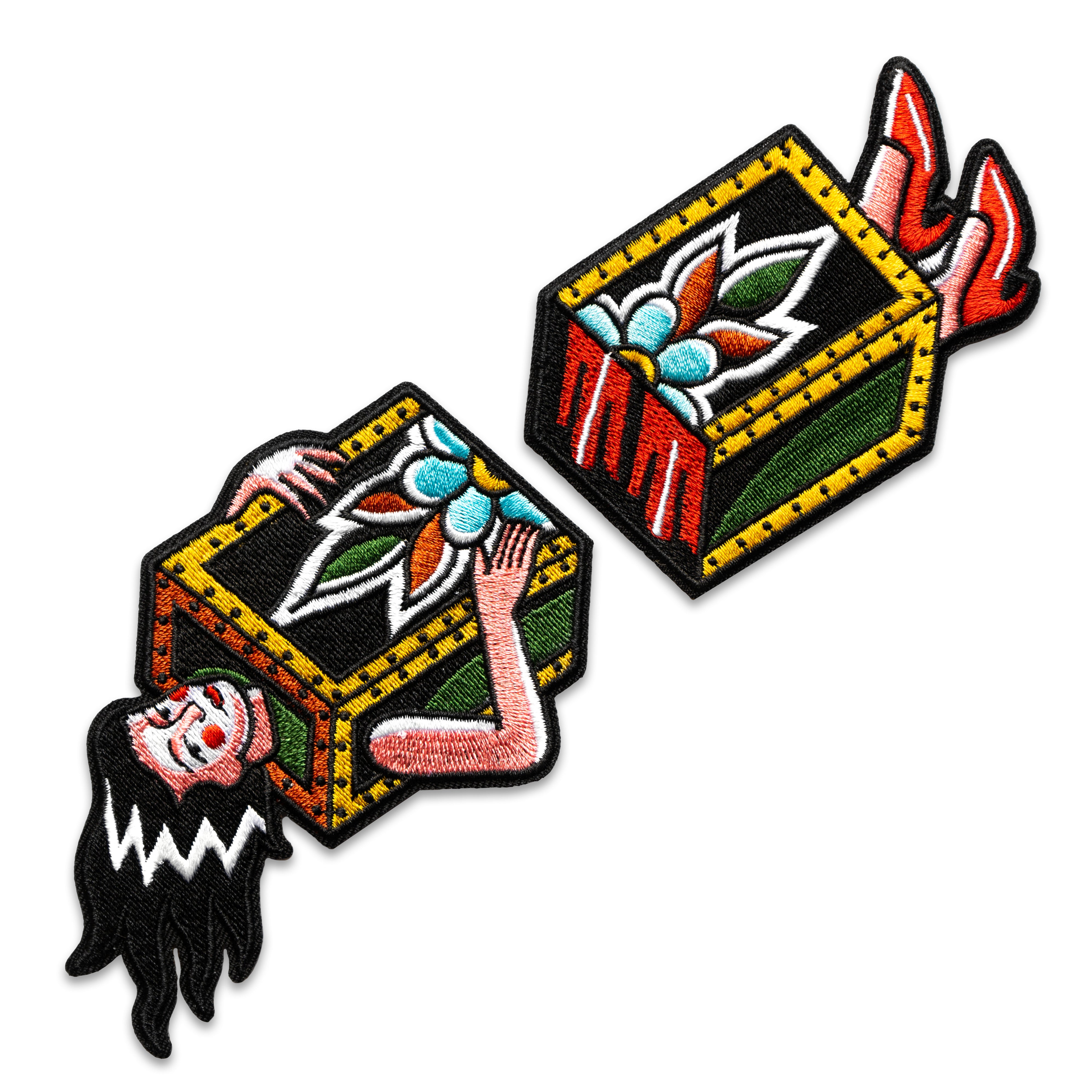A two-part patch designed in collaboration with Brandon Ing. The iron-on patch depicts the traditional "sawing in half" magic trick. One half is woman's torso in a box, the other half is her feet. Patch is embroidered with multiple colors, and is inspired by classic tattoo flash designs.