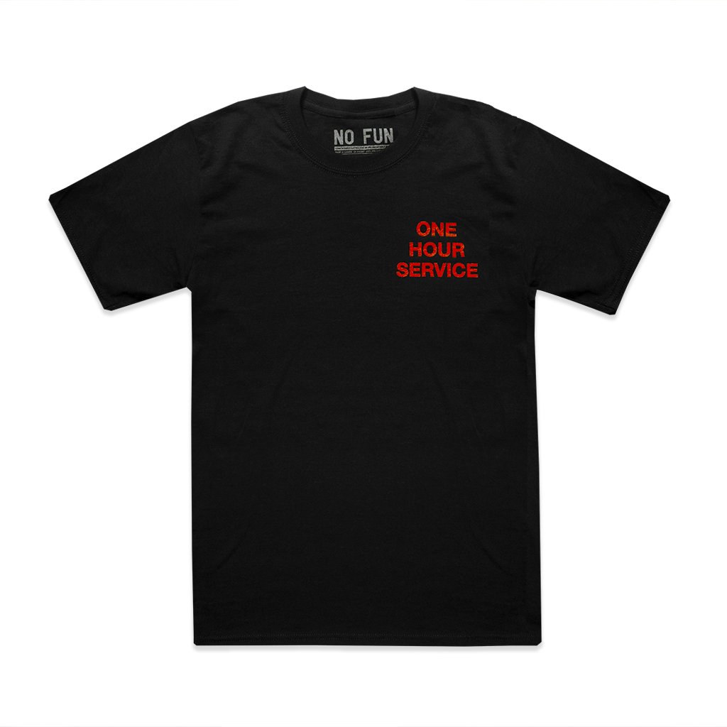 The No Fun Press "One Hour Service" T-Shirt in Night Shift Black. Designed and made in Toronto. T-shirt features red text that reads "ONE HOUR SERVICE" along the breast.