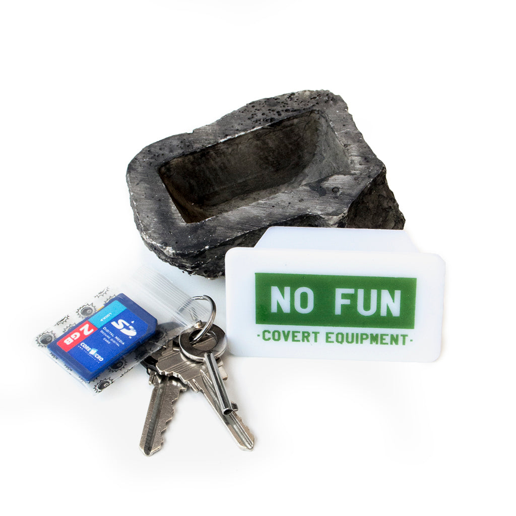 No Fun Press Rock, designed in Toronto. Text on the cover of the secret compartment reads "NO FUN - covert equipment"