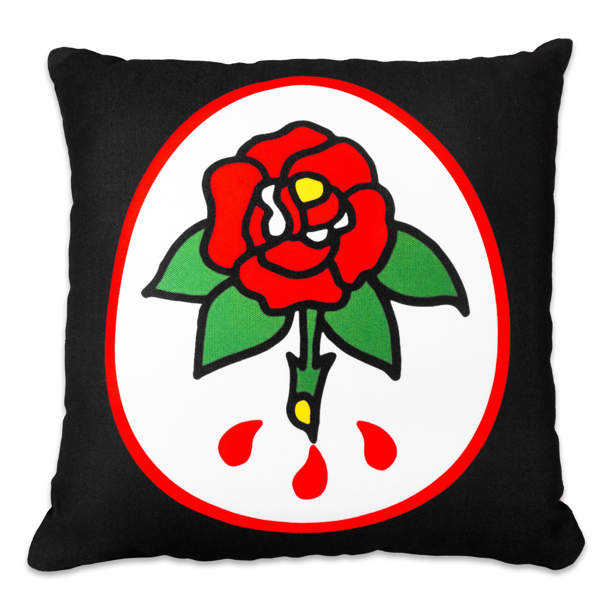 The "Sword & Rose" Pillow by No Fun®. Pillow is black, with a double sided design. One side has a red and white oval, with a cartoon rose in the center.  The rose is red, and has 4 green leaves and a green stem.  There are 3 red drips near the bottom of the stem.