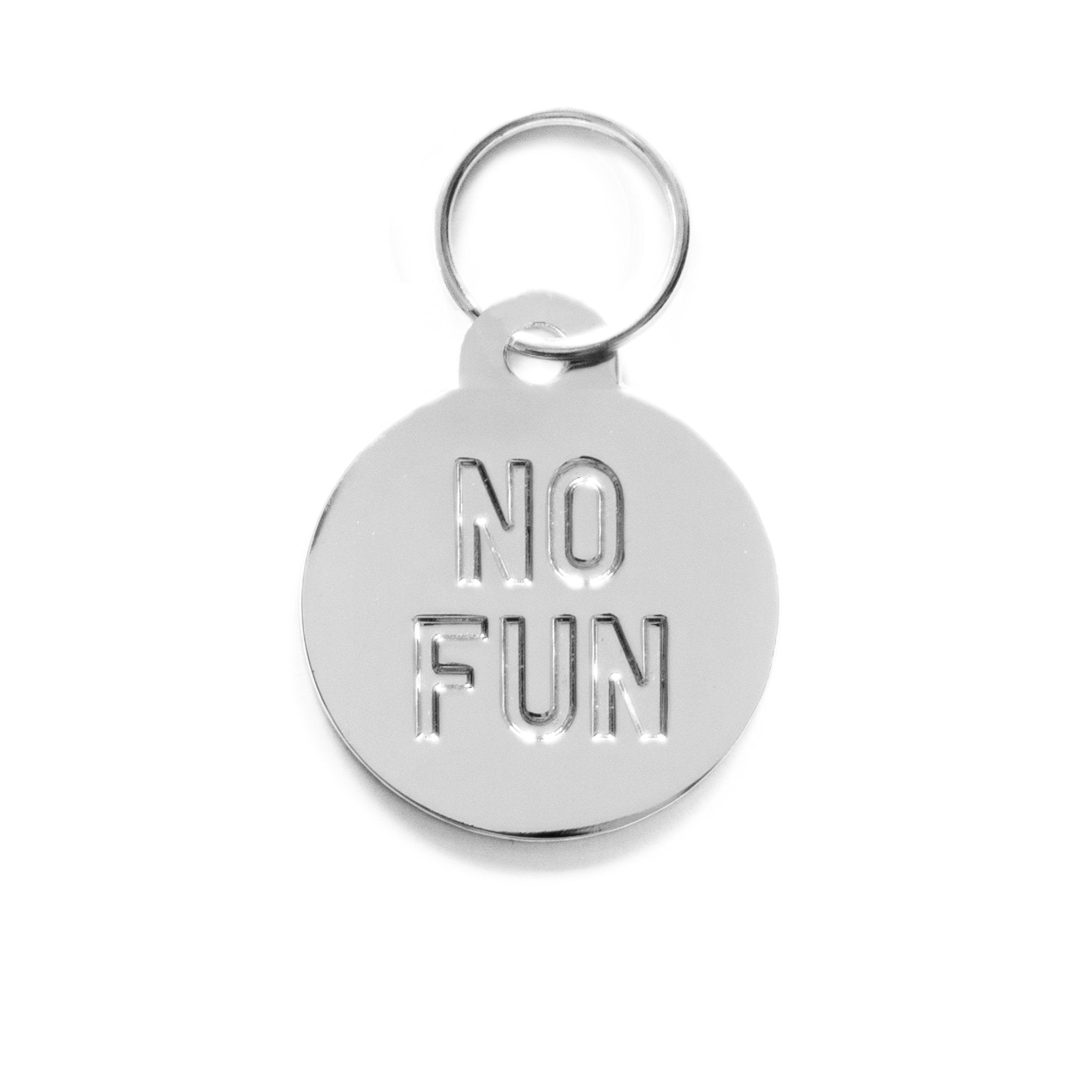 "No Fun®" circular Pet Tag Keyring in silver. 1.25" diameter molded metal keyring. Item is photographed against a white background to showcase the silver coloring.